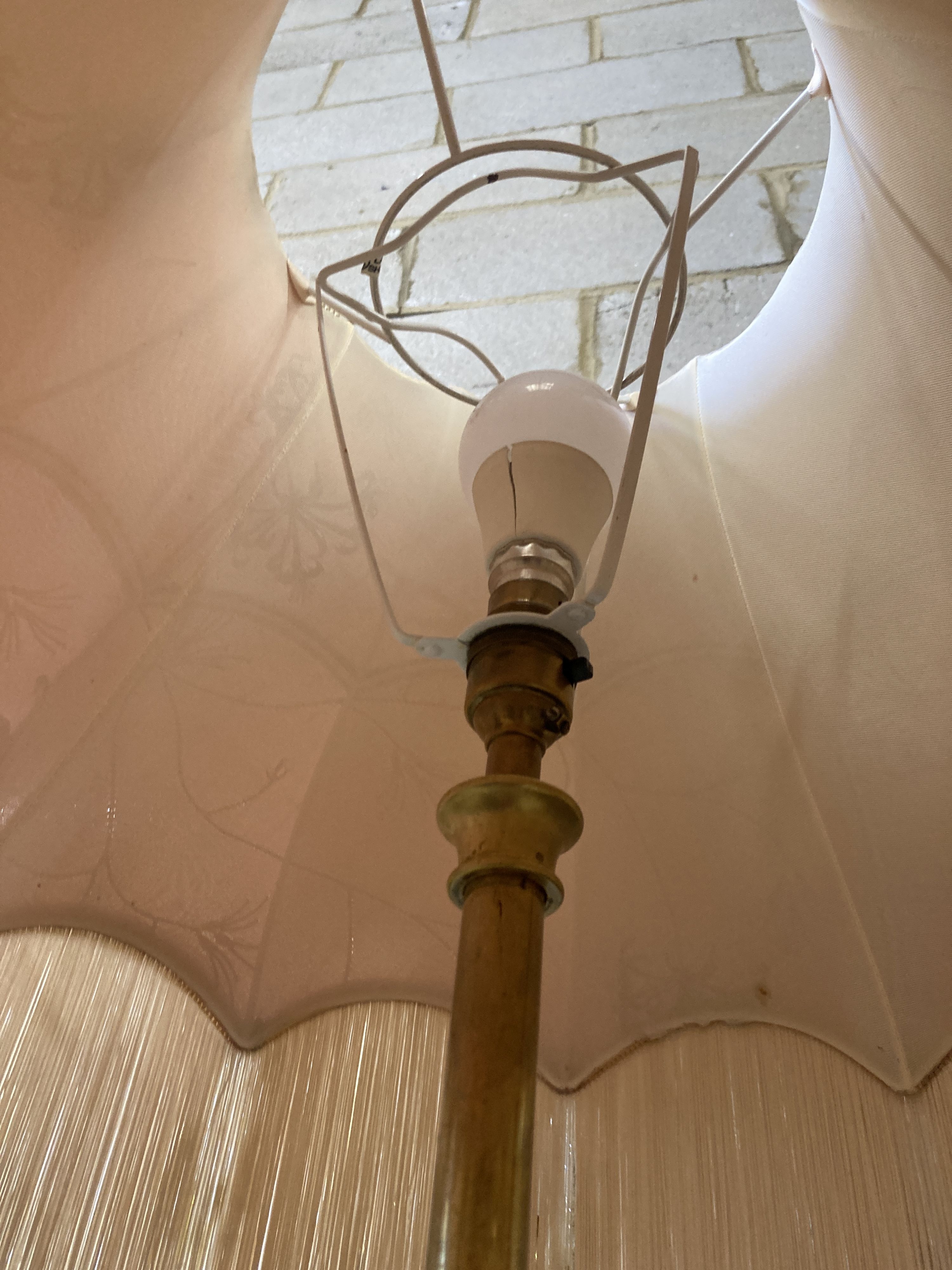 An Art Nouveau brass telescopic standard lamp